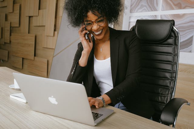a%20business%20person%20speaking%20on%20the%20phone%20while%20at%20their%20desk a%20business%20person%20speaking%20on%20the%20phone%20while%20at%20their%20desk
